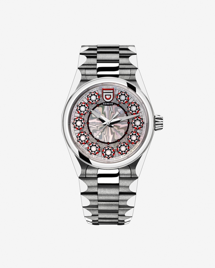 Montre Cinquième élément, en édition limitée, de la nouvelle collection Elements de ID Genève, lancée en 2024. Bracelet et boîtier en acier recyclé 100% suisse, mouvement reconditionné, cadran basés sur la technologie de la nanogravure développée par Morphotonix, une start-up suisse spécialisée dans les procédés d'impression de billets de banque et de passeports. Une montre suisse circulaire minimisant son impact.